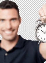 Cheerful young man with alarm clock